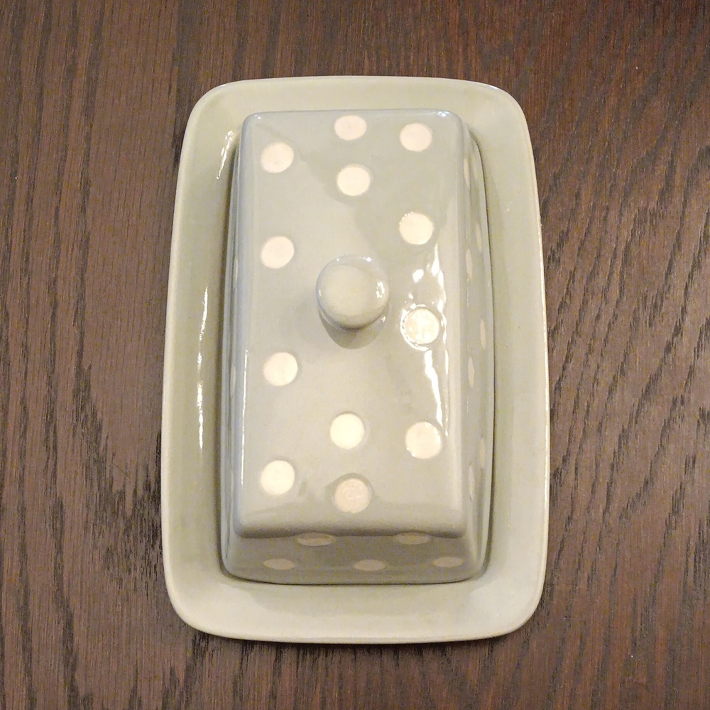 Creative Co-op butter dish. Greyish-blue with white polka dots.